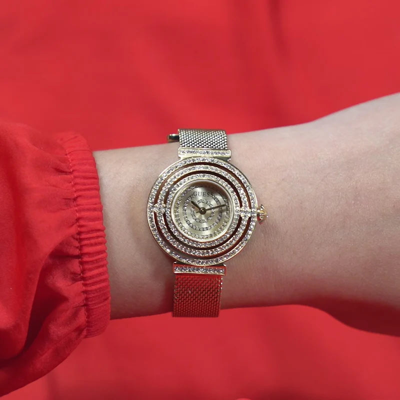 Guess Dream GW0550L2 women's watch worn on wrist with red sweater background