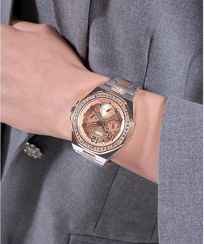 GUESS Empire womens watch worn on wrist with rose gold dial and crystal-set bezel