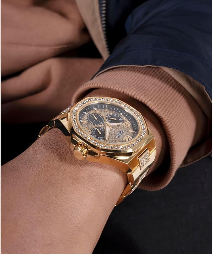 Guess Empire multi-function chronograph worn on wrist with dark sleeve