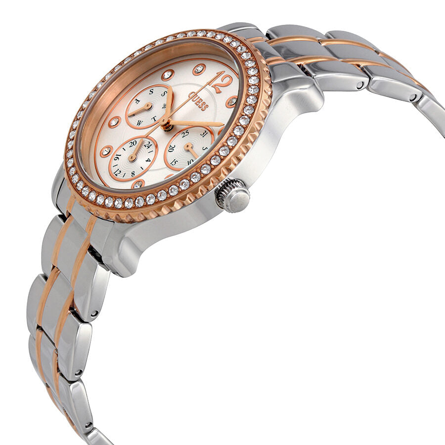 Side angle view of Guess Enchanting watch showing two-tone stainless steel and rose gold strap