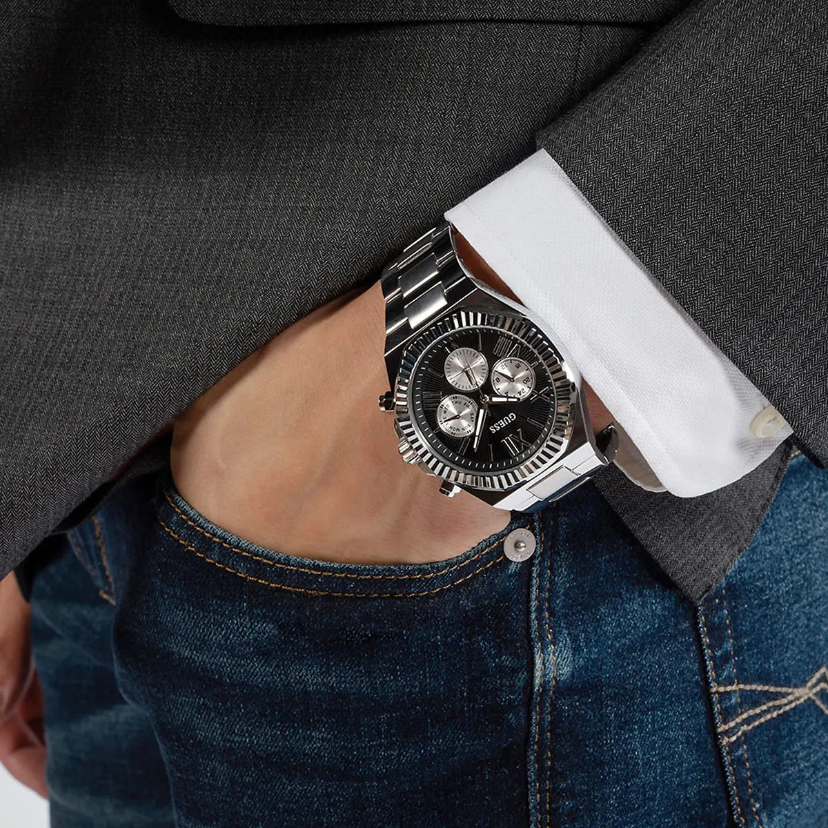 GUESS Equity mens chronograph watch worn on wrist with silver case and black dial