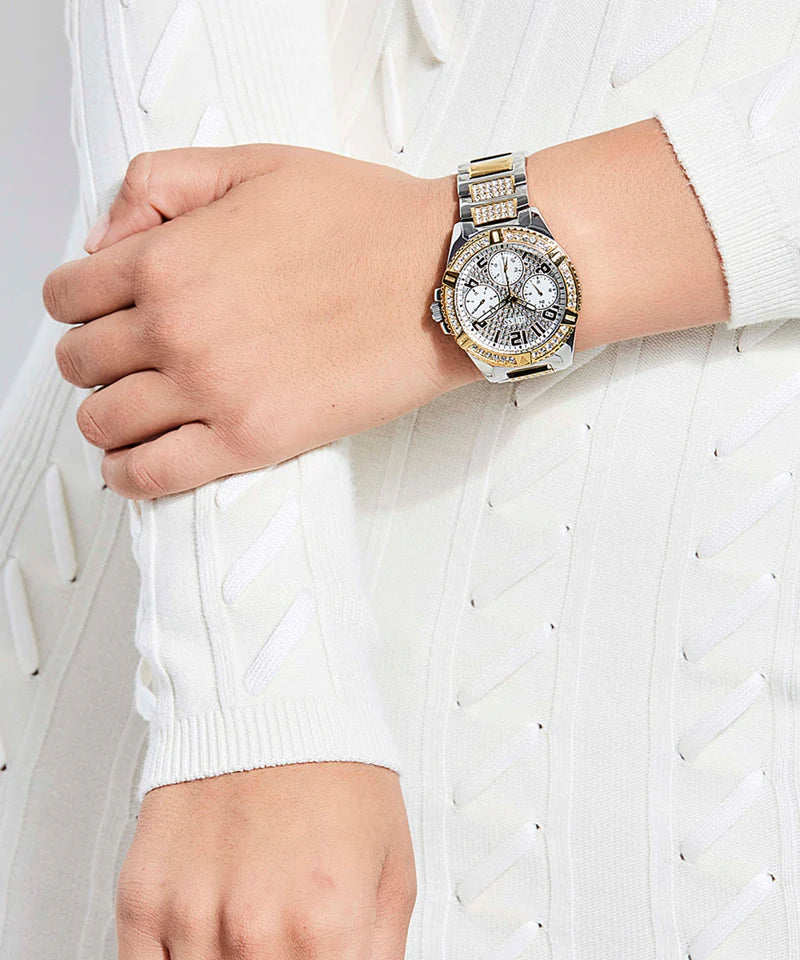 Guess Frontier chronograph watch worn on wrist, showing gold dial and two-tone bracelet