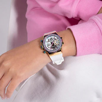 Guess Fusion Chronograph watch worn on wrist with white strap and gold case