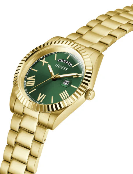 GUESS GENTS FRONTIER watch at angle showing gold bracelet strap, green dial with day window, and gold fluted bezel