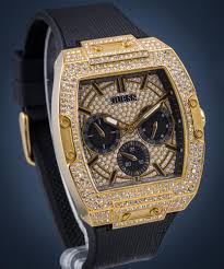 GUESS GW0048G2 watch angled view showing gold tone case with crystal bezel and black leather strap