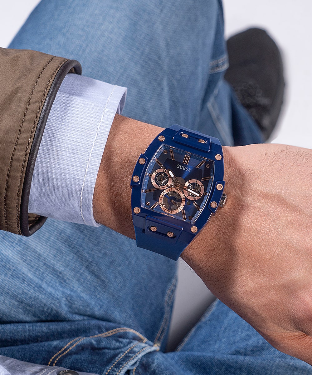Guess skeleton dial watch on wrist worn with casual clothing