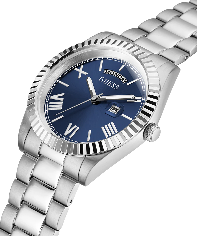 GUESS silver tone watch at angle showing blue dial, Roman numerals, and three-link bracelet detail