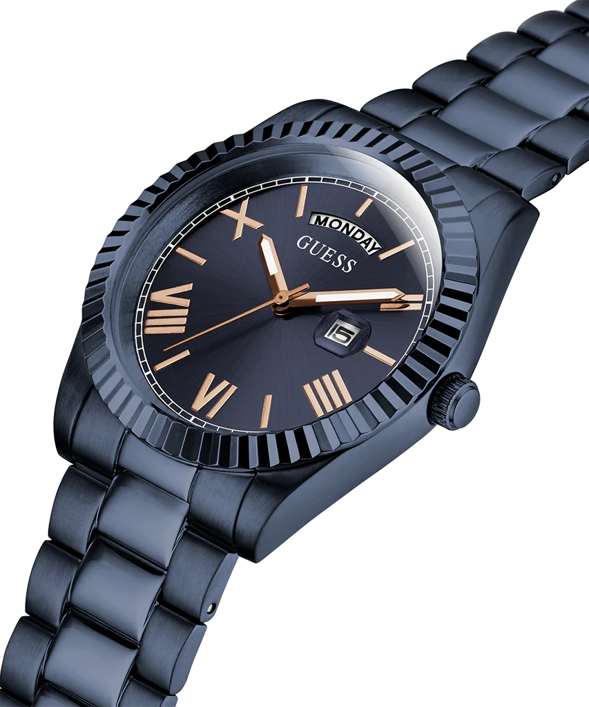 Angled view of GUESS Navy watch showing dial detail with day/date window and gold-tone accents