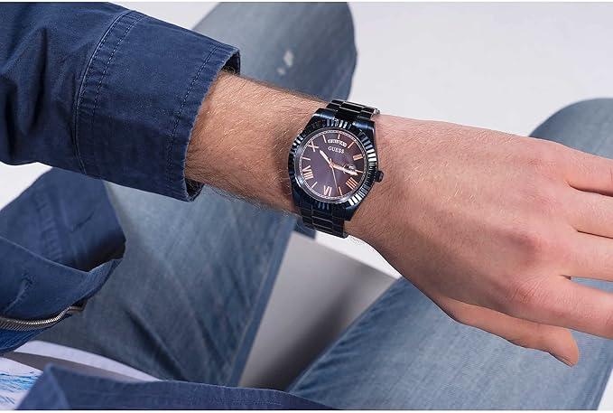 GUESS Navy watch worn on wrist showing dial and bracelet in lifestyle setting