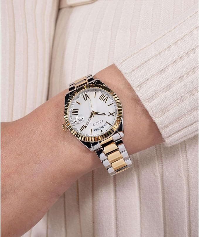 GUESS 2-tone watch on wrist showing white dial and Roman numerals details