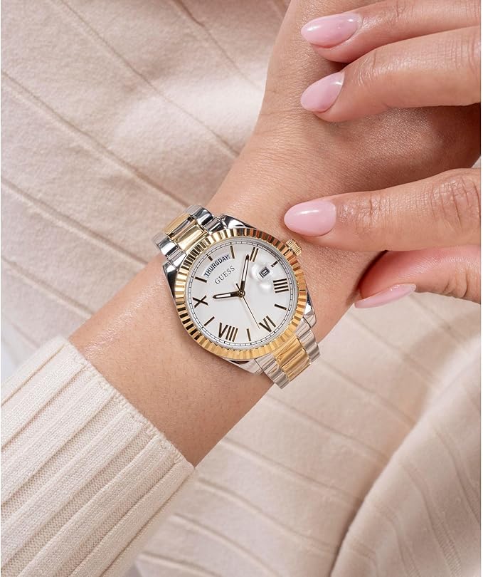 GUESS ladies watch on wrist displaying gold/silver 2-tone design