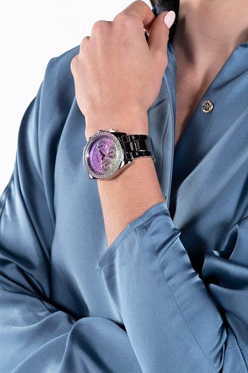 GUESS silver-tone multifunction watch worn on wrist with ombre glitter dial