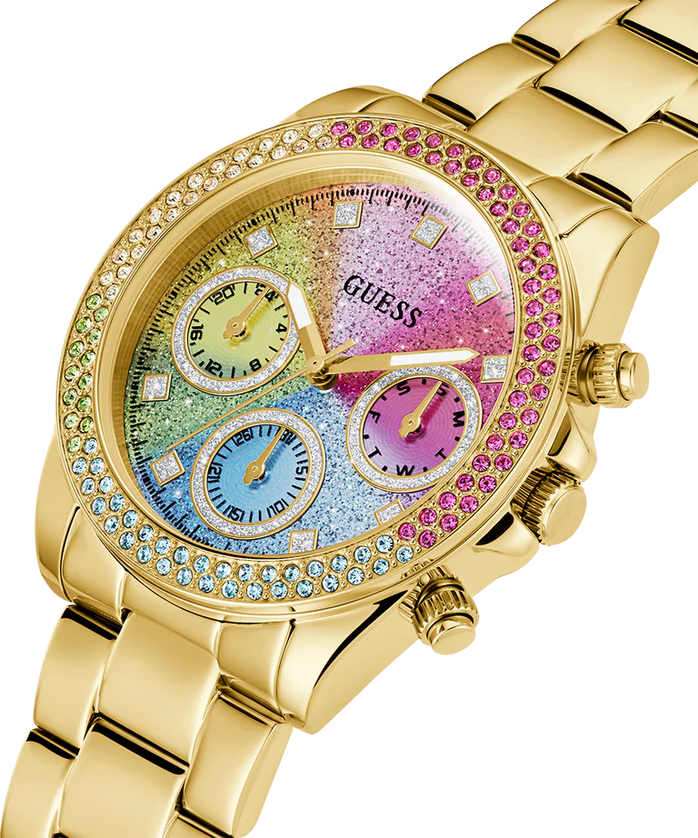 Side angle view of Guess gold watch showing crystal-adorned bezel and colorful glitter subdials