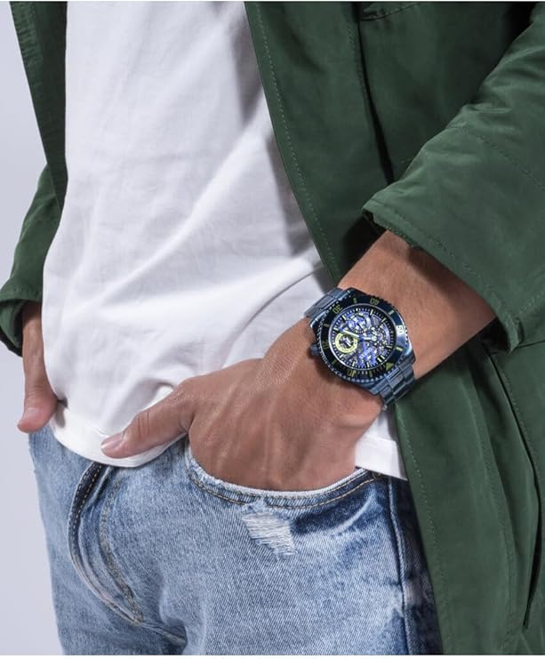 GUESS GW0488G4 navy watch worn on wrist with casual styling