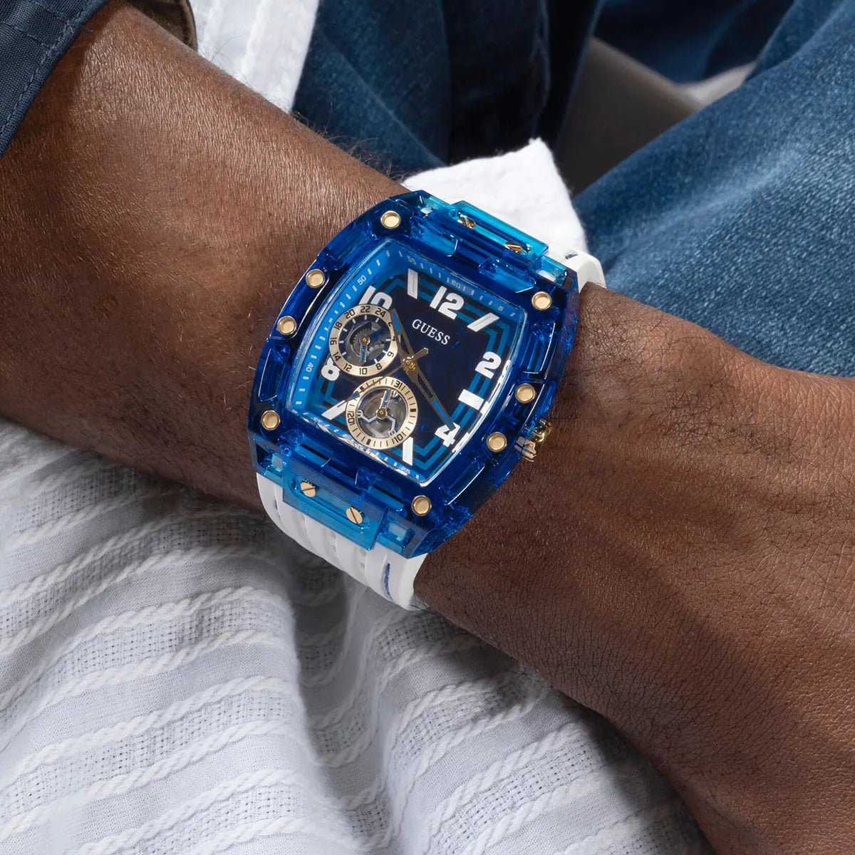 GUESS GW0499G6 watch on wrist showing blue case and white strap styling