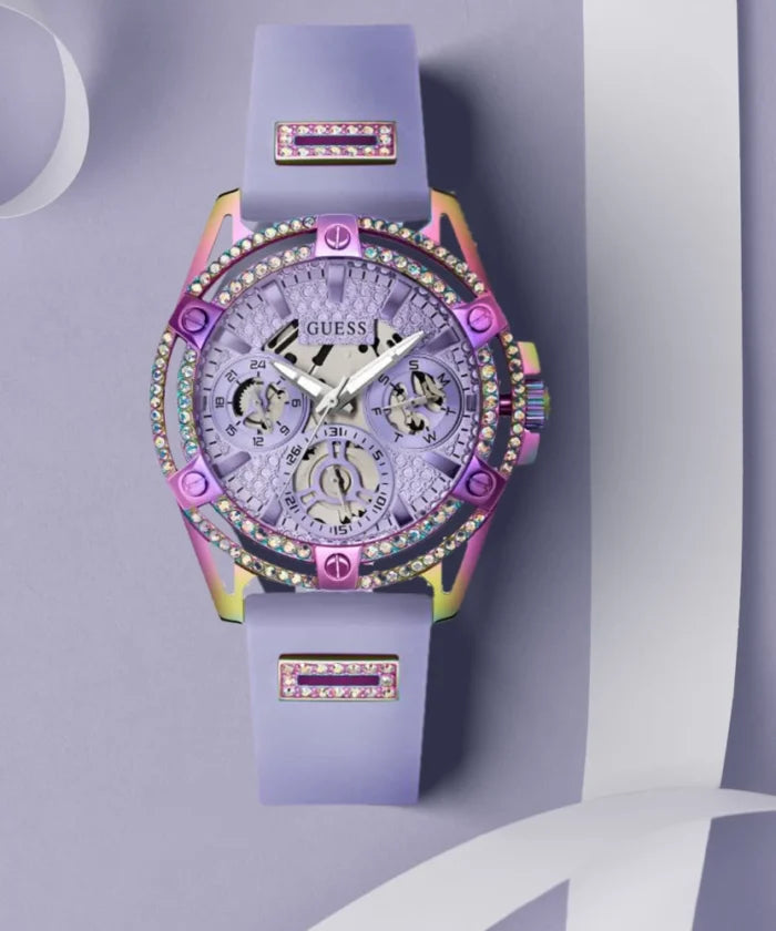 GUESS purple iridescent watch displayed on wrist with colorful silicone strap