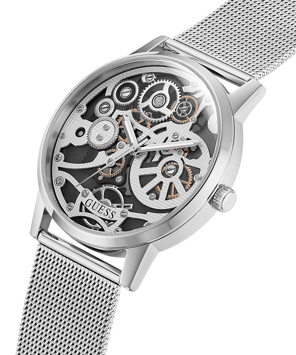 Guess men's watch at angle showing exposed gear dial and silver mesh band