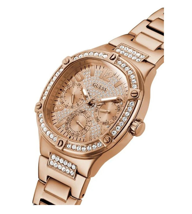 Angled side view of GUESS GW0558L3 rose gold watch with crystal bezel and bracelet
