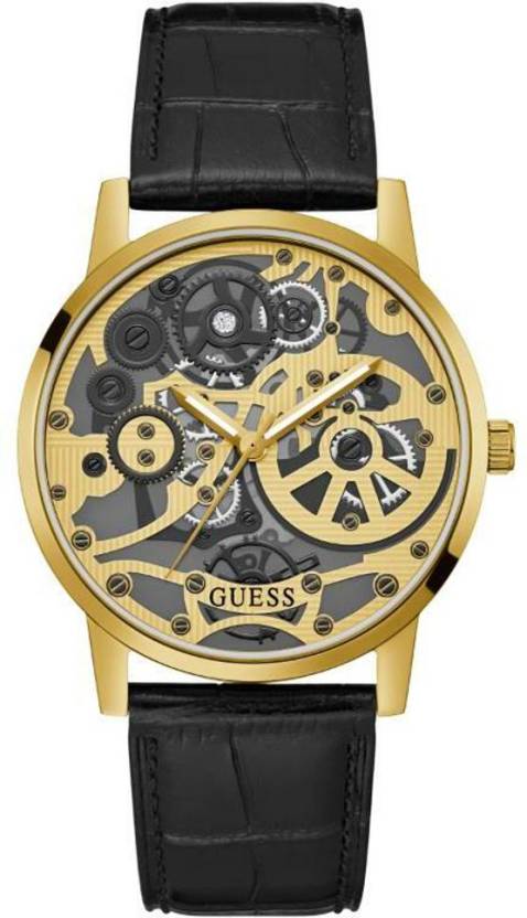 Gold tone skeleton watch with black leather strap and visible mechanical movement dial
