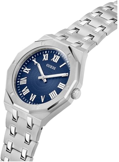 Guess GW0575G4 watch on wrist showing blue dial with Roman numerals and stainless steel bracelet