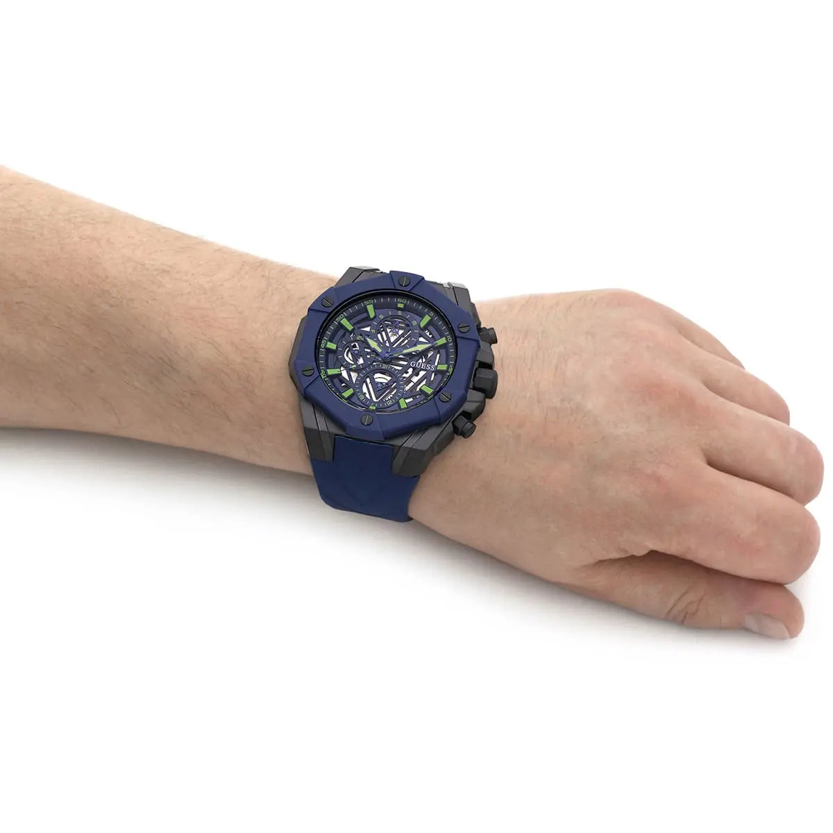 GUESS GW0579G3 blue watch with skeleton dial worn on wrist