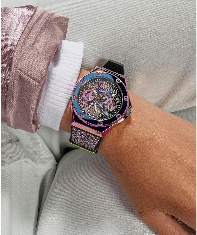 Guess GW0620L4 women's watch on wrist showcasing purple multifunction dial and glitter strap
