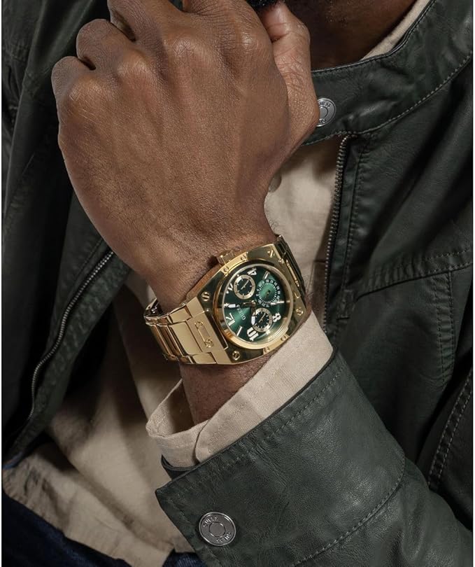 Guess GW0624G2 worn on wrist showing green chronograph dial and gold case