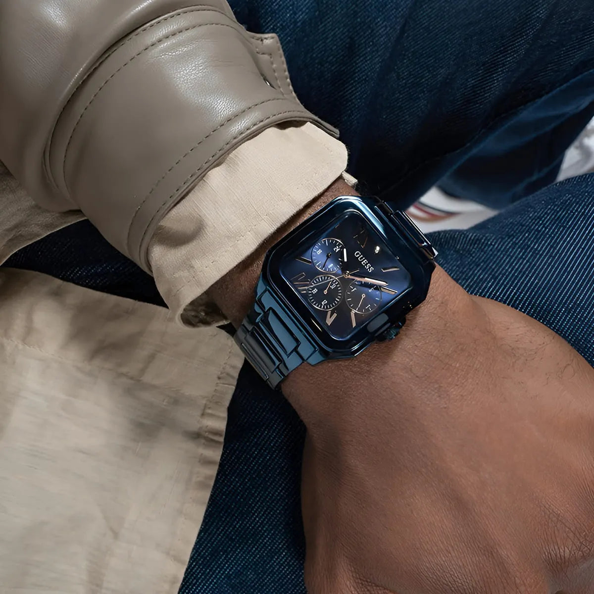 Guess GW0631G3 blue watch worn on wrist with casual outfit showing dial and case styling