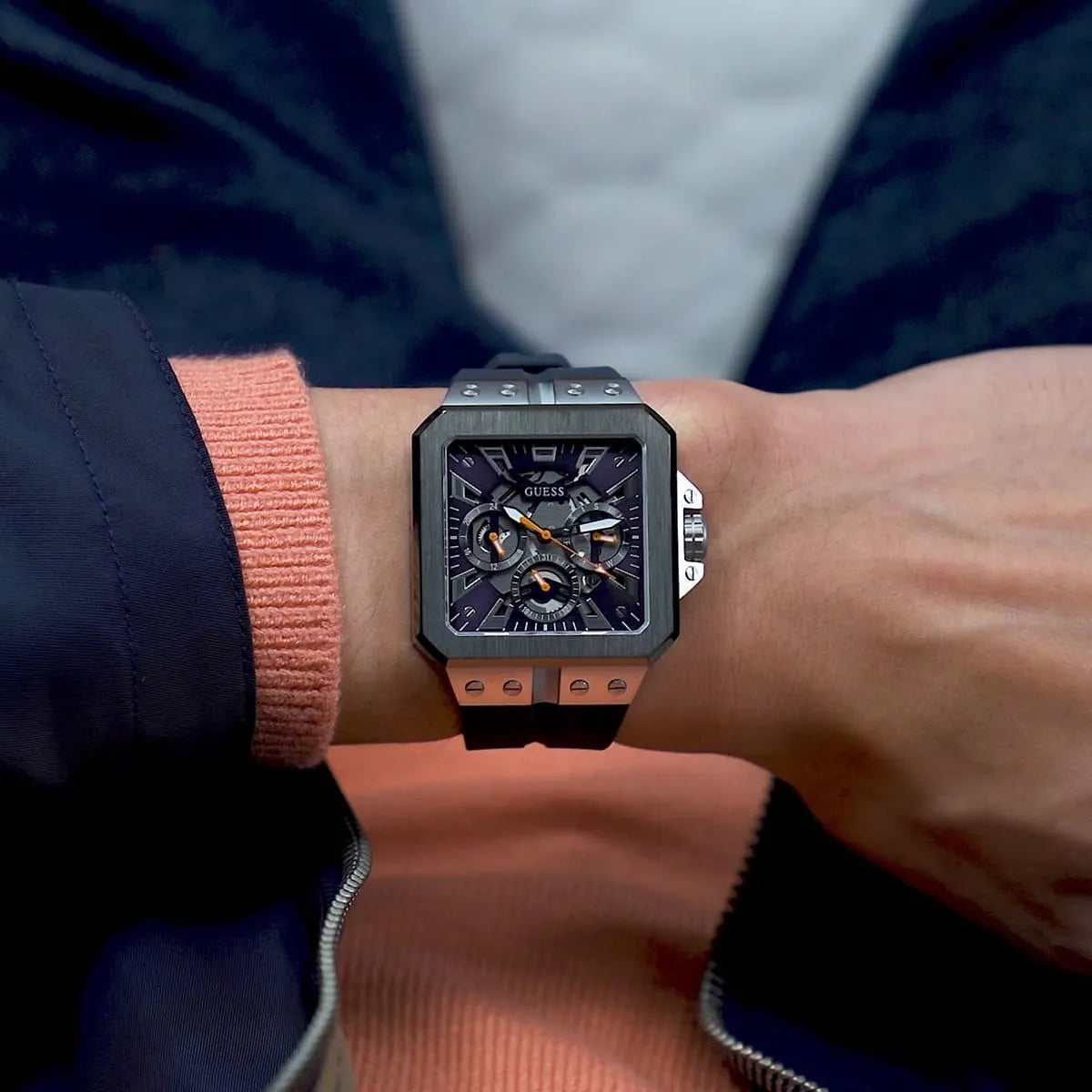 Guess GW0637G1 chronograph watch worn on wrist showing square case and navy rubber strap