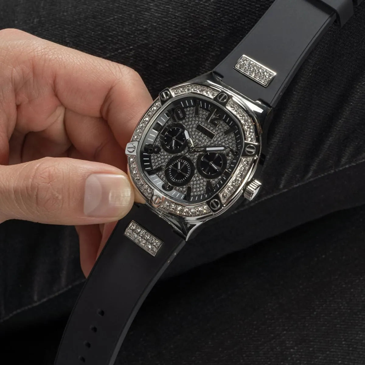 GUESS GW0641G1 chronograph watch on wrist showing crystal bezel and black rubber band