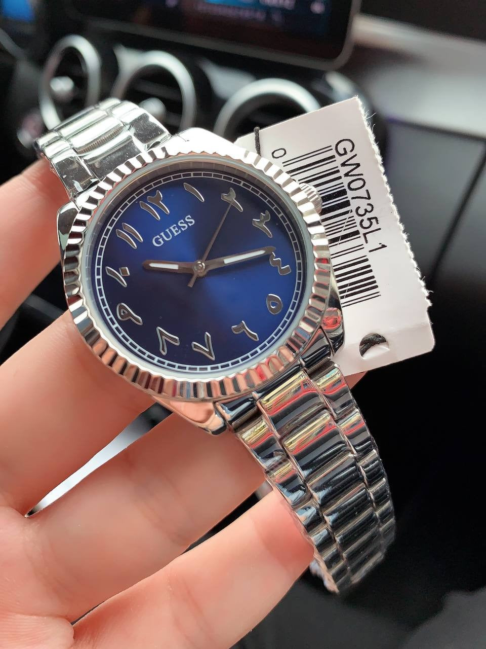 GUESS GW0735L1 women's watch worn on wrist with product tag