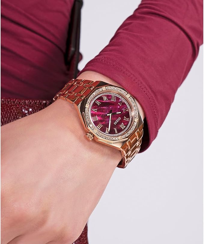 GUESS GW0770L3 rose gold watch worn on wrist with burgundy sleeves