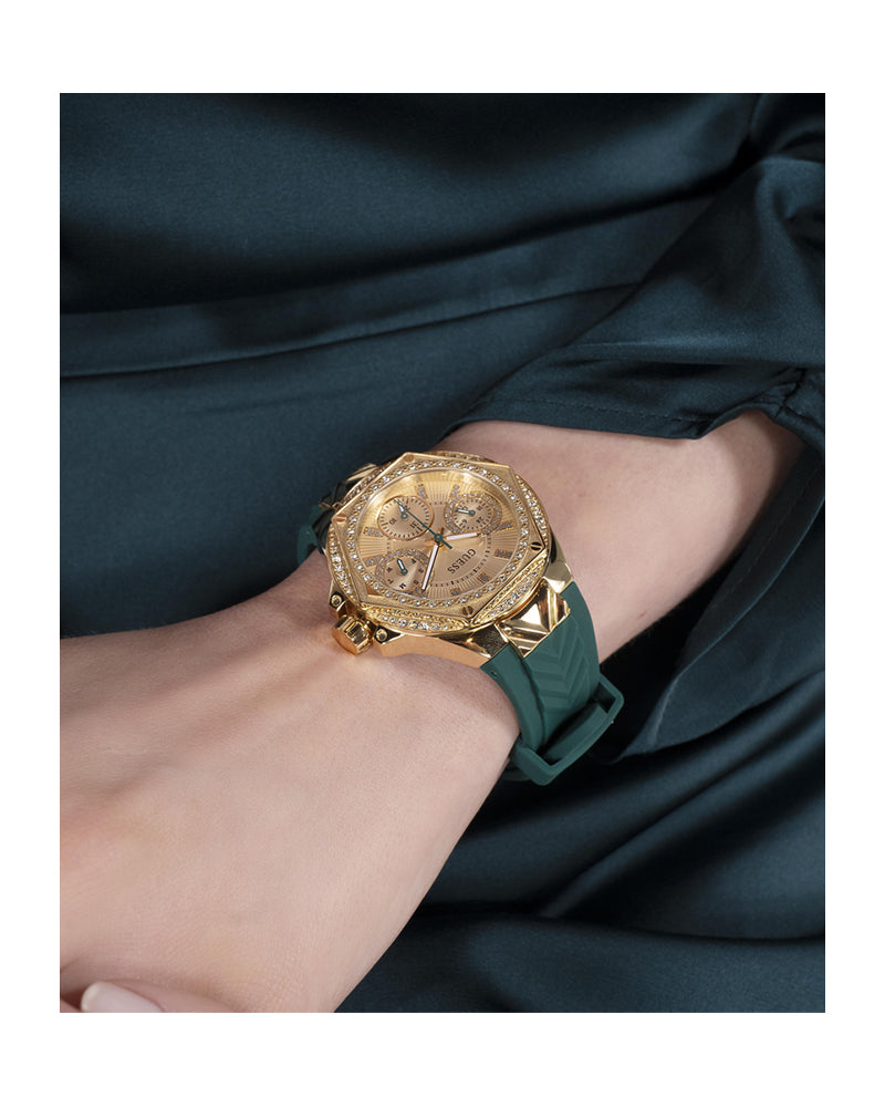 Two-tone multifunction watch worn on wrist with green strap