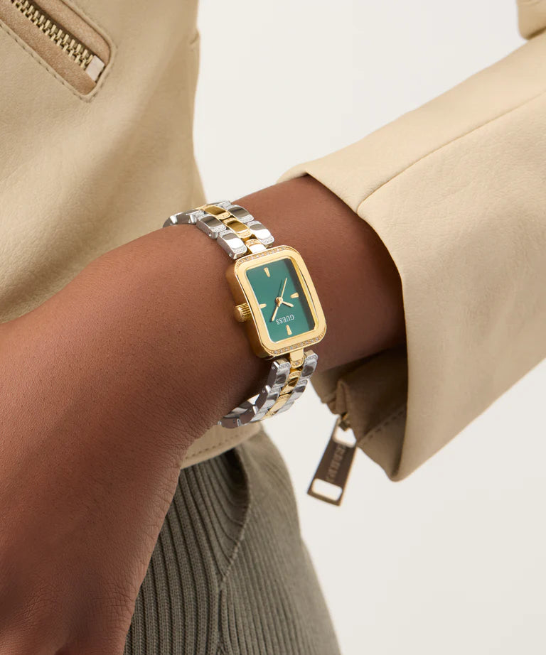 GUESS GW0865L6 ladies watch worn on wrist showing green dial and gold-silver bracelet