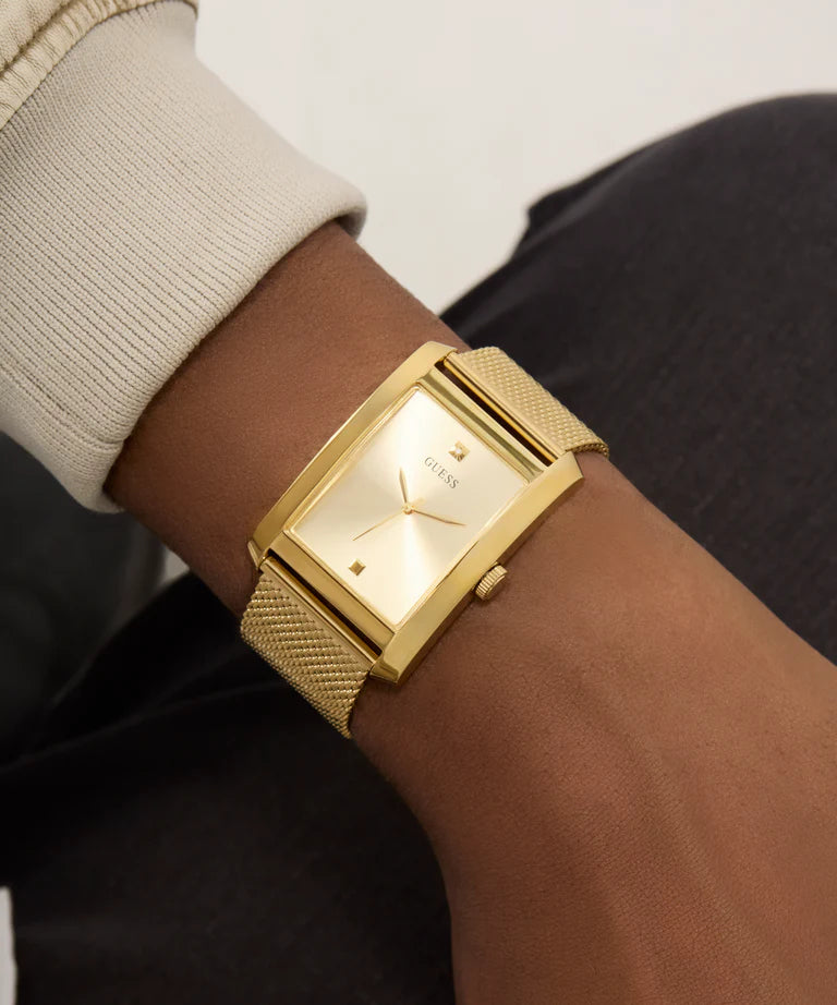 GUESS GW0898G1 gold rectangular watch on wrist detail view