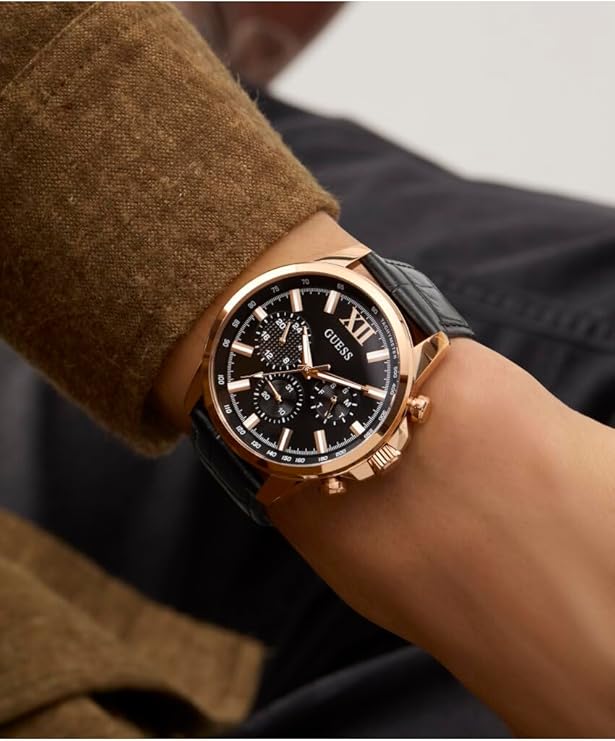 On-wrist view of Guess GW0901G5 with black leather strap and multi-function chronograph subdials