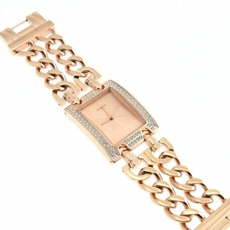 Guess Heavy Metal rose gold watch on wrist showing chain-link bracelet and crystal bezel