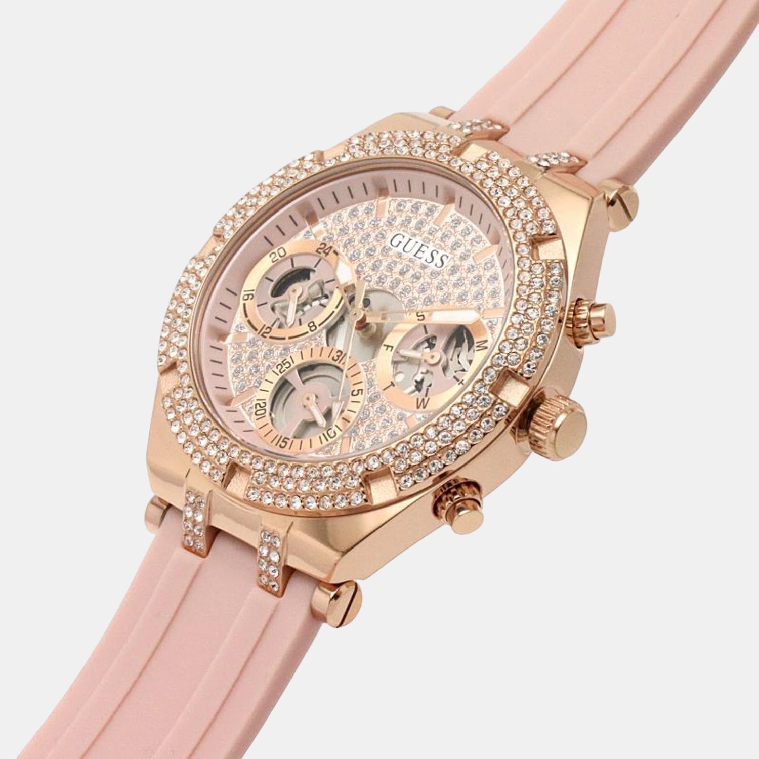 Guess Heiress rose gold watch on wrist showing chronograph subdials and pink silicone strap detail