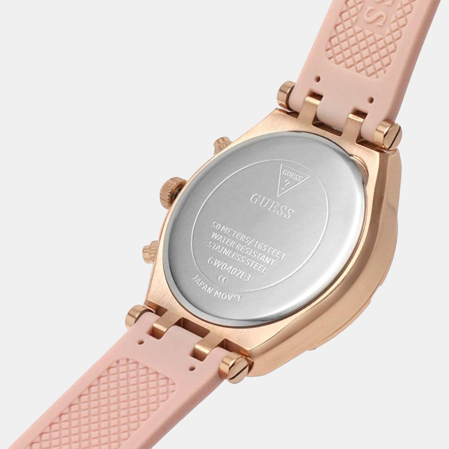 Guess Heiress watch caseback showing engraved case details and pink quilted silicone strap