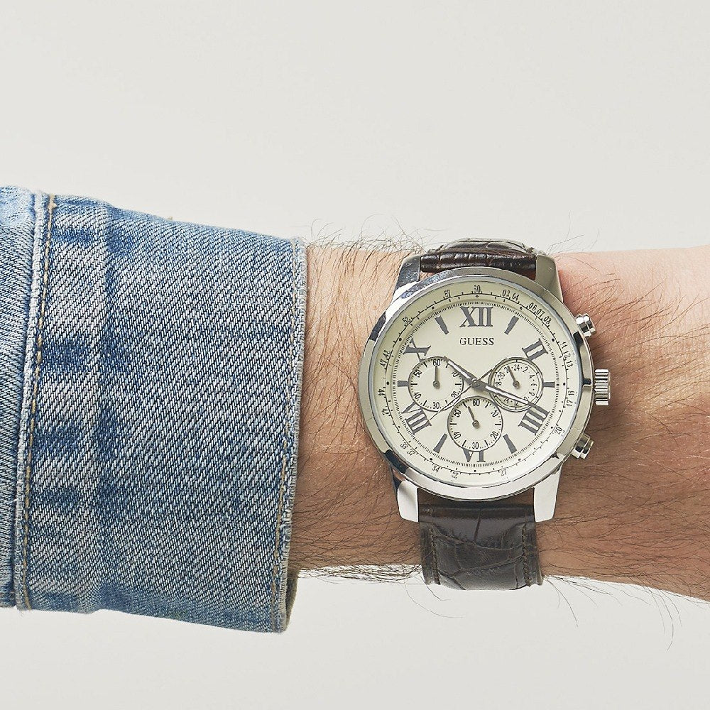 Guess Horizon chronograph watch worn on wrist with dark leather strap