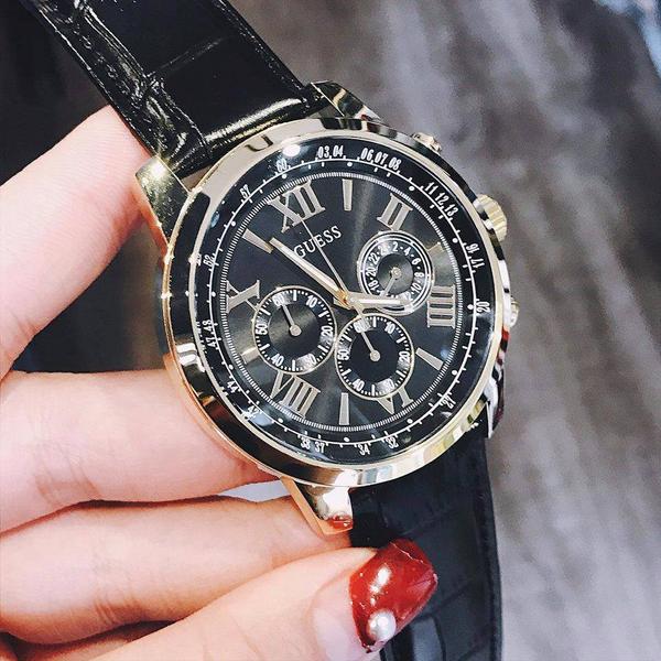 Guess Horizon chronograph watch worn on wrist showing black dial with three subdials