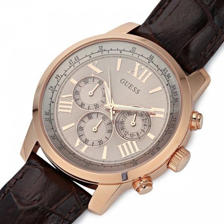 Guess Horizon W0380G4 chronograph watch detail showing silver dial and brown leather strap