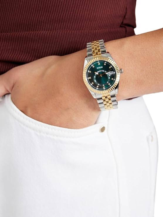 GUESS Jada watch worn on wrist showing 2-tone bracelet and dark green dial