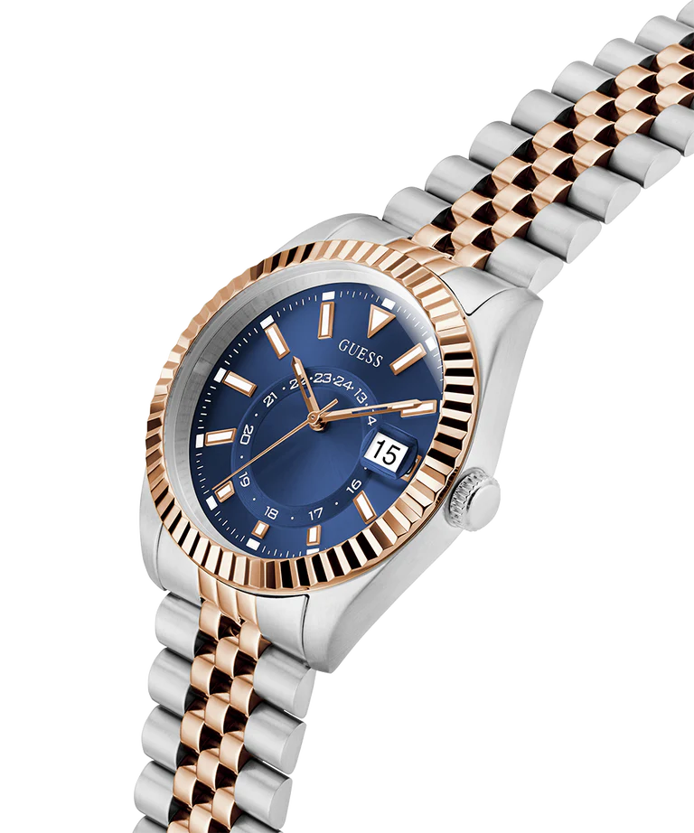 Angled view of GUESS Jaden watch displaying blue dial and two-tone bracelet