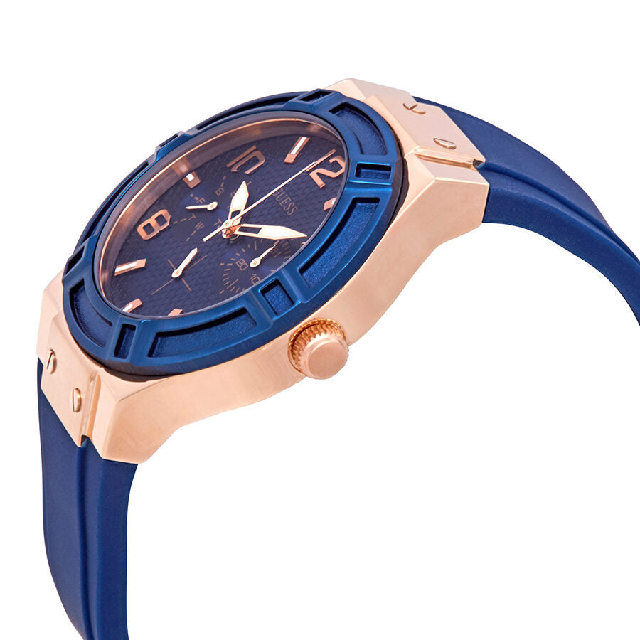Side angle view of Guess Jet Setter watch showing rose gold case and blue strap