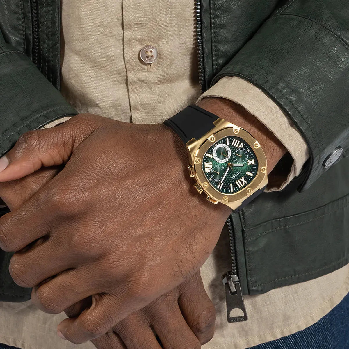 Guess Legacy watch on wrist with gold case and green dial