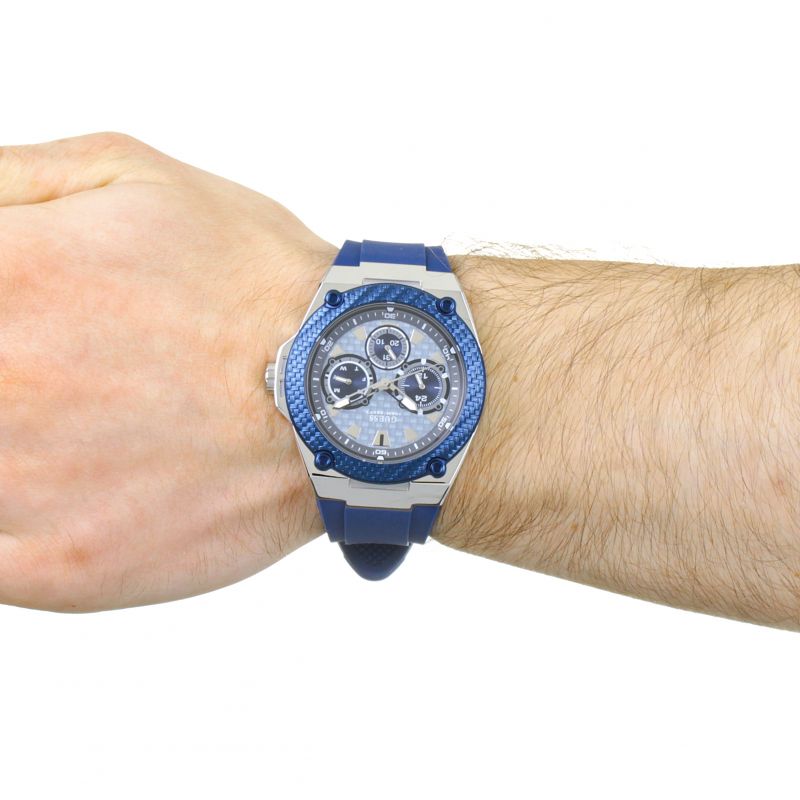 Guess Legacy watch on wrist showing blue dial and blue silicone strap