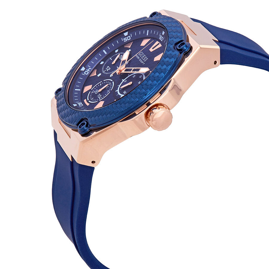 Guess Legacy watch side view showing rose gold case, blue bezel, and navy silicone strap
