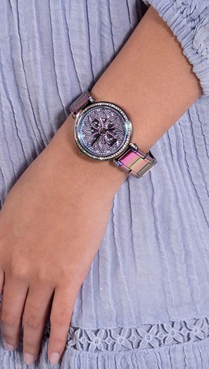 Guess Lily watch worn on wrist showing iridescent dial and multicolor bracelet detail
