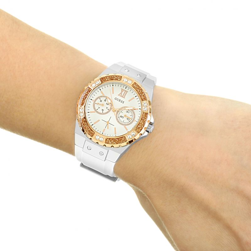 Guess Limelight ladies watch worn on wrist with white silicone strap and crystal bezel